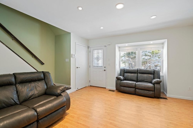 living room with light hardwood / wood-style flooring