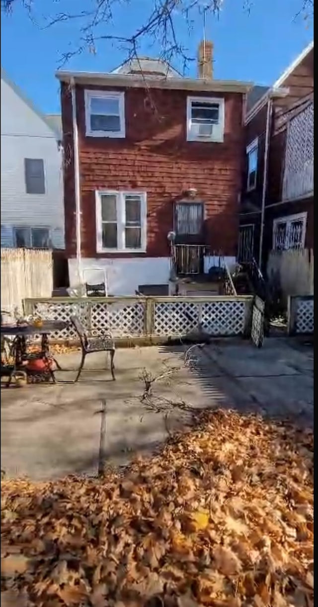 rear view of property featuring a patio area