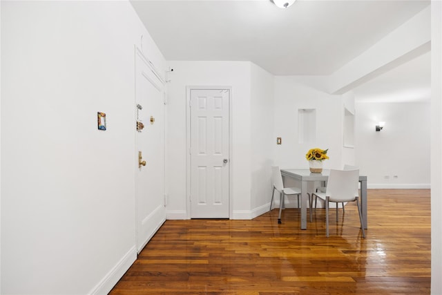 dining area featuring dark hardwood / wood-style floors