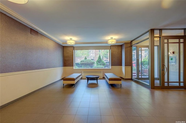 unfurnished room with tile patterned flooring, ornamental molding, and a wealth of natural light