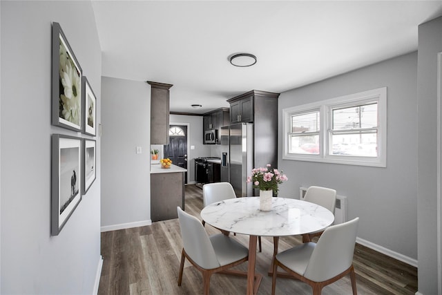 dining area featuring dark hardwood / wood-style flooring