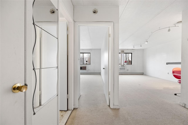 hall featuring light colored carpet and a baseboard radiator