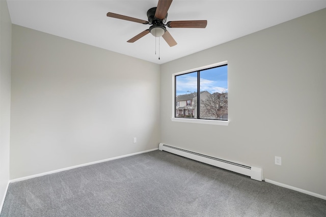 carpeted empty room with ceiling fan and a baseboard heating unit