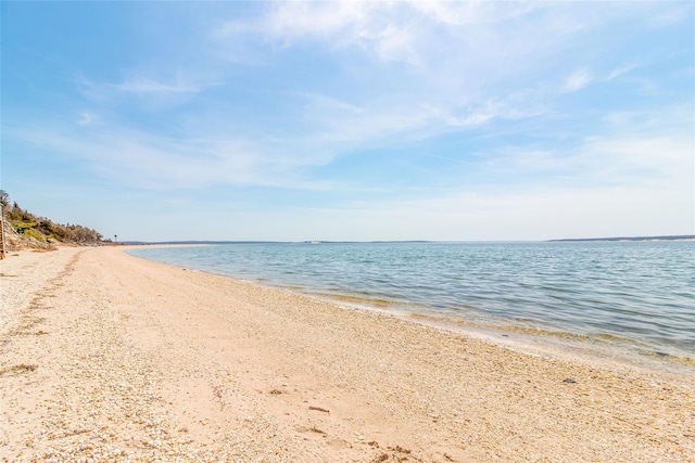 property view of water featuring a beach view