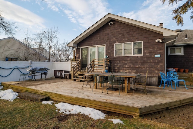 back of property featuring a wooden deck