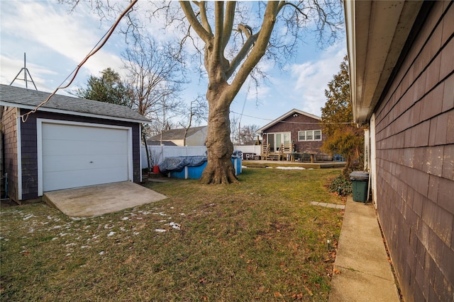 view of yard with an outbuilding and a garage