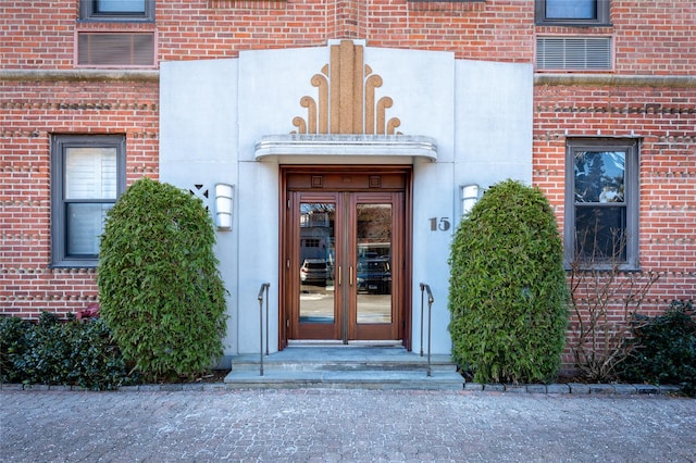 view of exterior entry featuring french doors