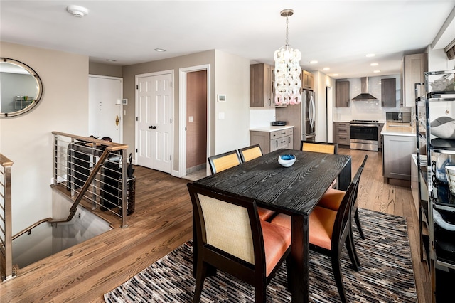 dining room featuring a chandelier and hardwood / wood-style flooring