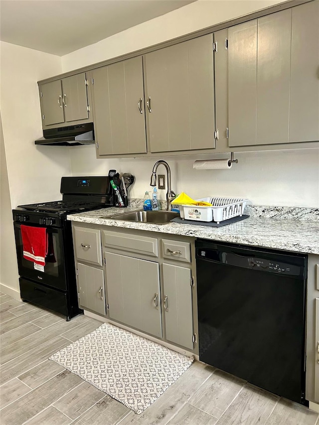 kitchen featuring gray cabinets, sink, and black appliances