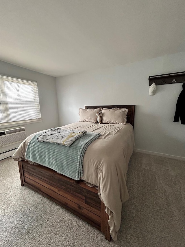 bedroom featuring carpet flooring and an AC wall unit