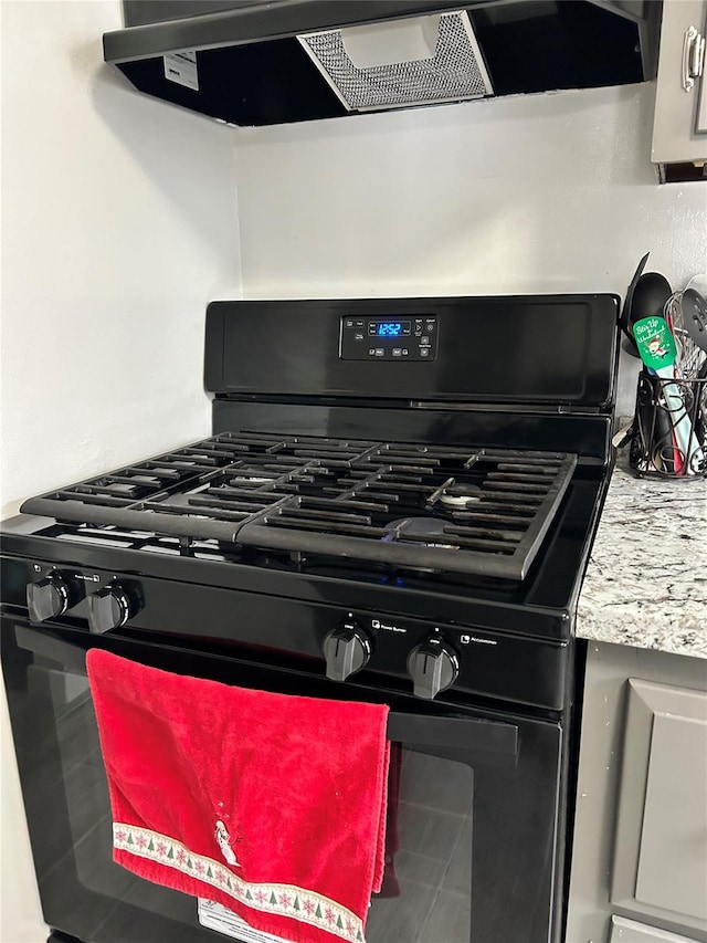 interior details featuring extractor fan and black range with gas stovetop