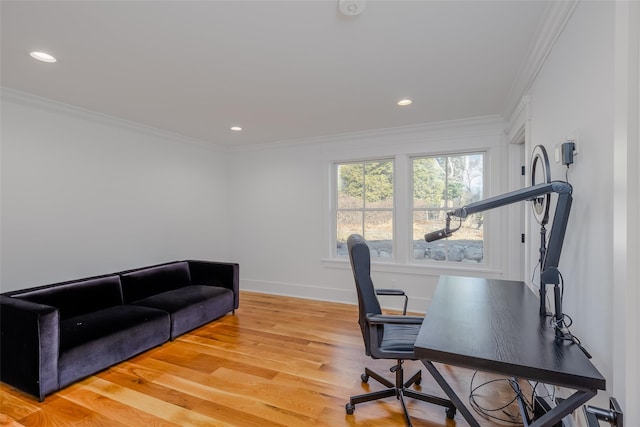 office featuring light wood-type flooring and crown molding