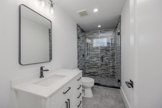 bathroom featuring toilet, walk in shower, and vanity