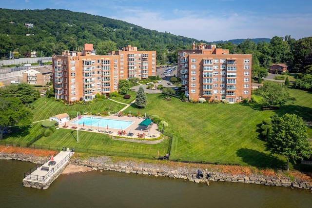 birds eye view of property with a water view