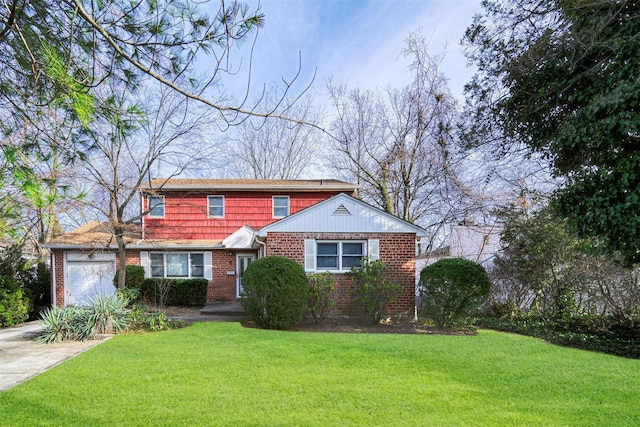 view of front of home with a front yard and a garage