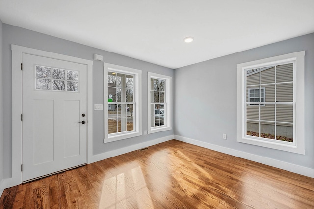 entrance foyer with hardwood / wood-style floors