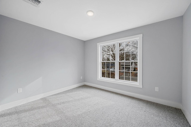 spare room featuring carpet flooring