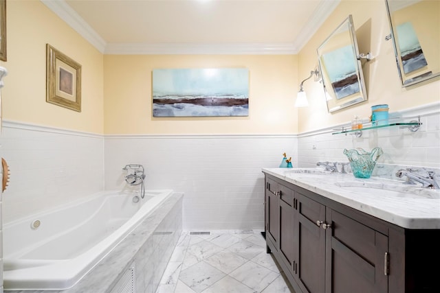 bathroom with ornamental molding, a tub to relax in, and vanity