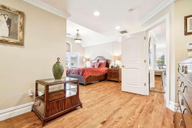 bedroom with ornamental molding, vaulted ceiling, and light hardwood / wood-style flooring