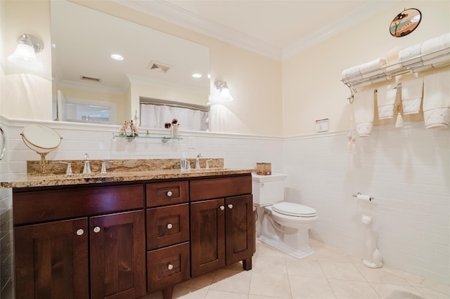 bathroom featuring ornamental molding, tile walls, vanity, and toilet