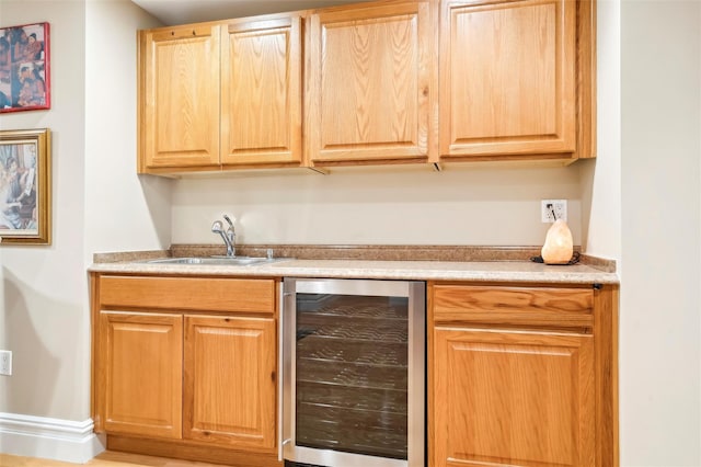 bar with wine cooler and sink