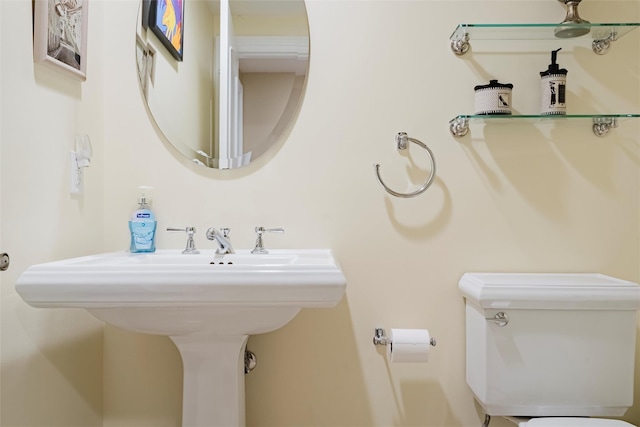 bathroom with toilet and sink