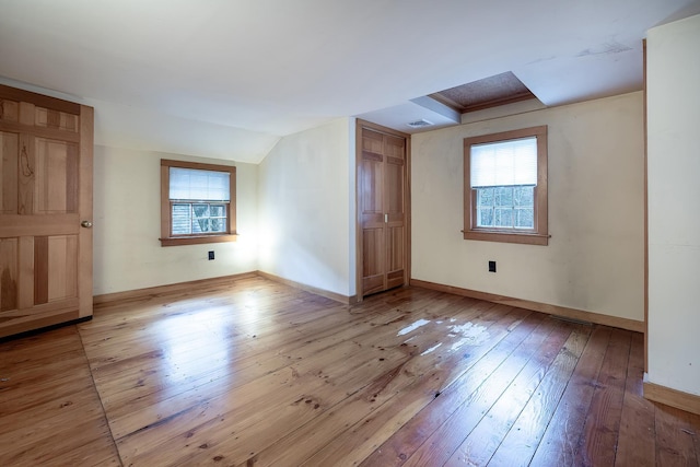 additional living space with a wealth of natural light and light hardwood / wood-style floors