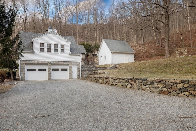 view of side of property with a garage