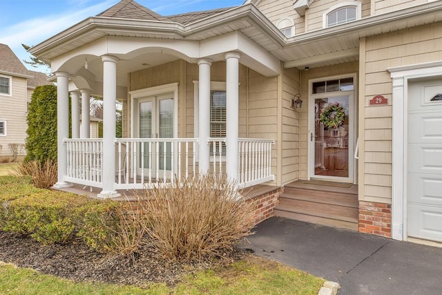 entrance to property featuring covered porch