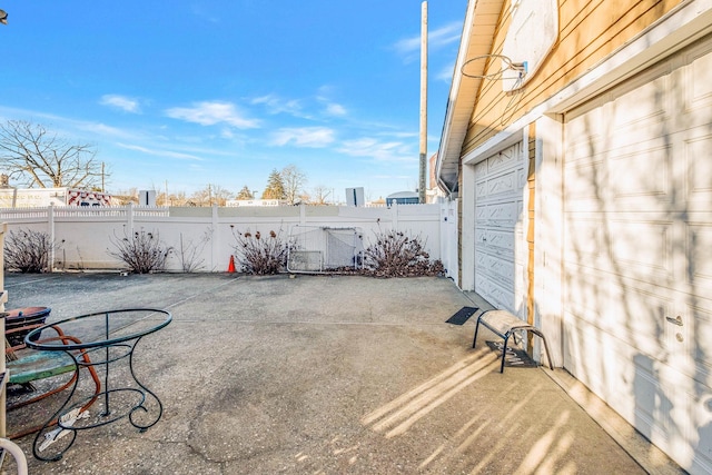 view of patio with a garage