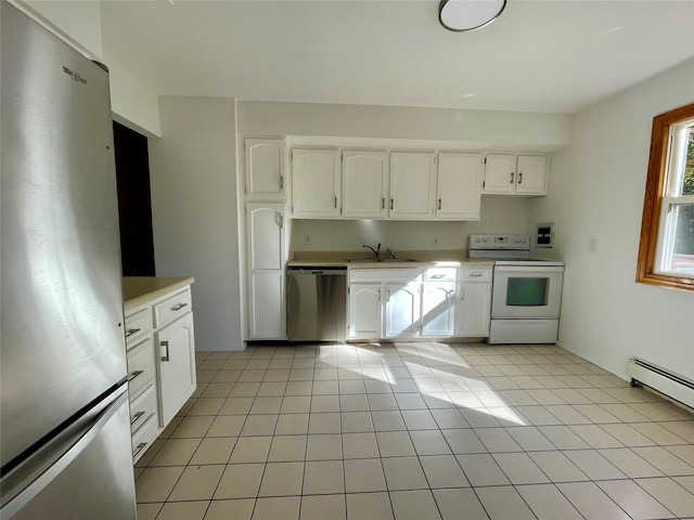 kitchen with stainless steel appliances, light tile patterned floors, a baseboard heating unit, white cabinets, and sink