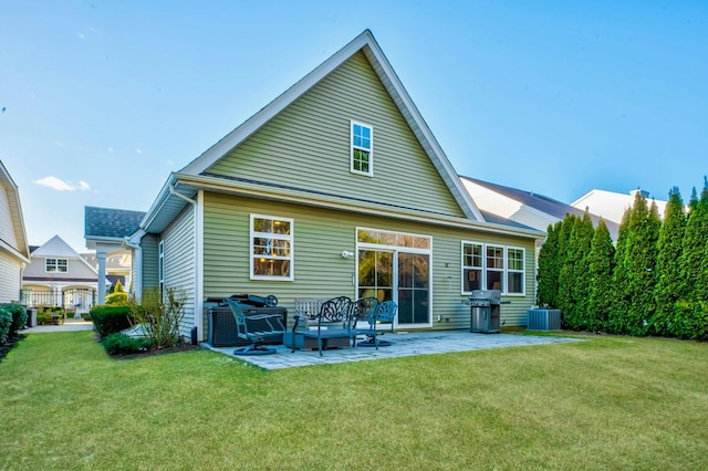 back of house featuring a patio, central air condition unit, and a yard