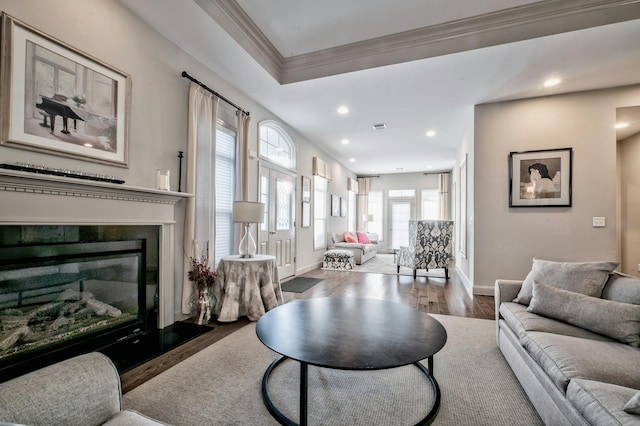 living room featuring crown molding and hardwood / wood-style floors