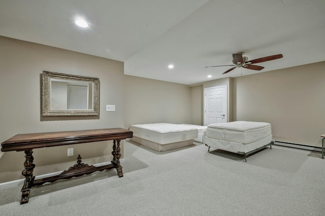 bedroom featuring ceiling fan, a baseboard radiator, and light carpet