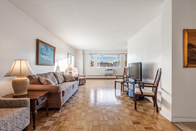 living room with baseboard heating and light parquet floors