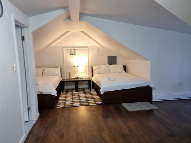 bedroom featuring lofted ceiling and dark hardwood / wood-style flooring