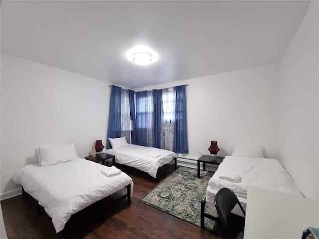 bedroom featuring dark hardwood / wood-style flooring