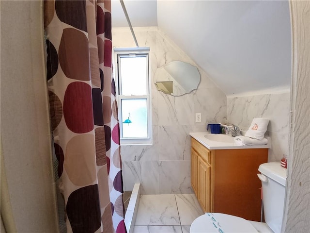 bathroom with toilet, vanity, a shower with curtain, and a healthy amount of sunlight