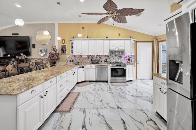 kitchen featuring backsplash, pendant lighting, ornamental molding, and stainless steel appliances