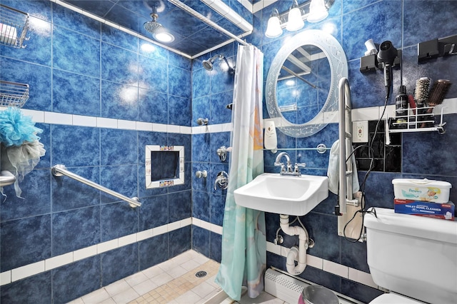 bathroom with toilet, tile walls, sink, and walk in shower