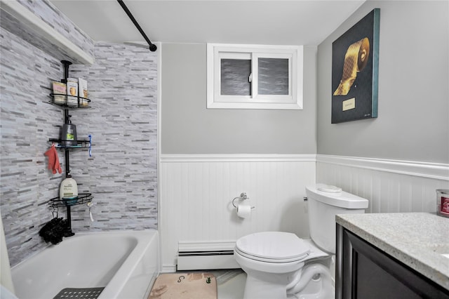 full bathroom with toilet, baseboard heating, tub / shower combination, and vanity