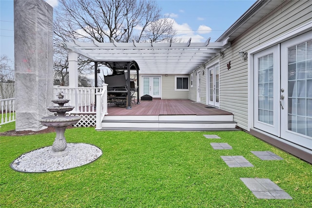 view of yard featuring a wooden deck, french doors, and a pergola