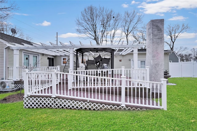 rear view of house featuring ac unit, a yard, a pergola, and a wooden deck