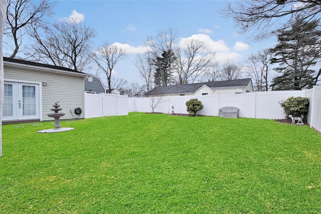 view of yard featuring french doors