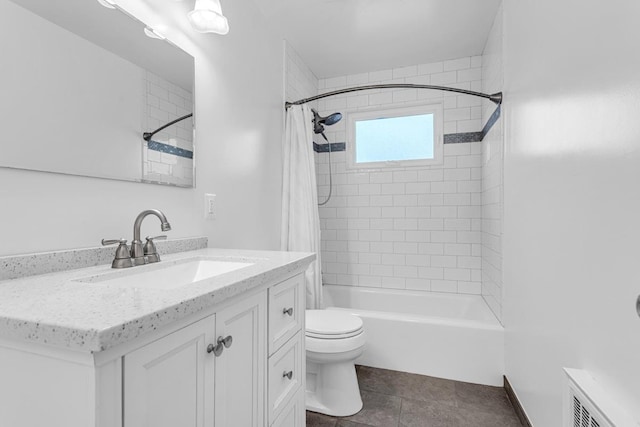 full bathroom with tile patterned flooring, shower / bath combo with shower curtain, vanity, and toilet