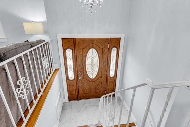 entrance foyer with a chandelier