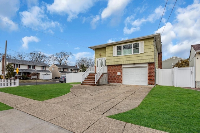 bi-level home featuring a front yard and a garage