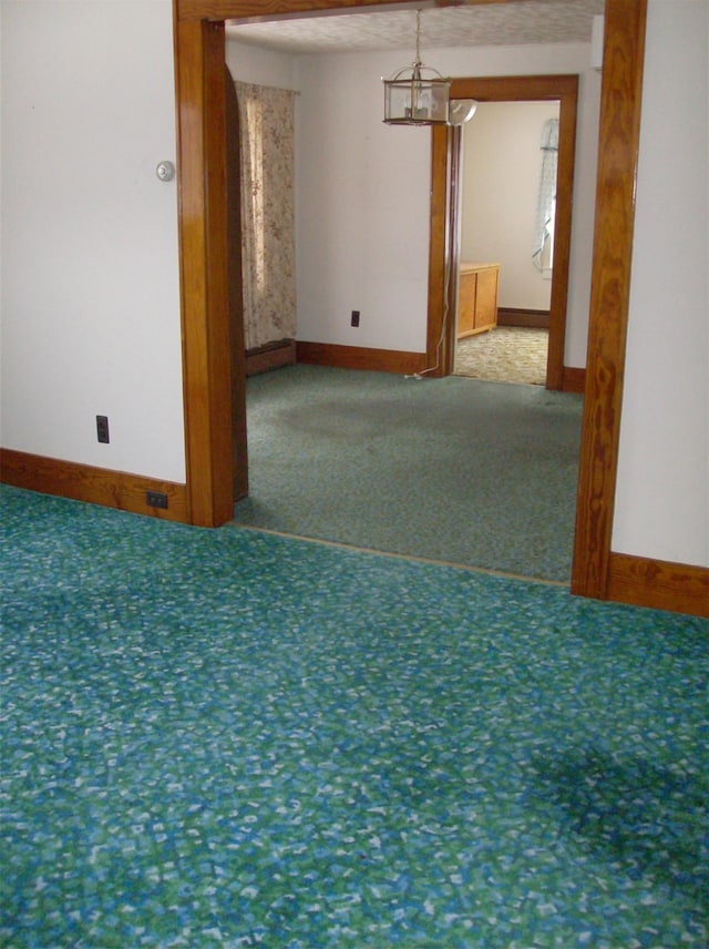 unfurnished room featuring carpet flooring