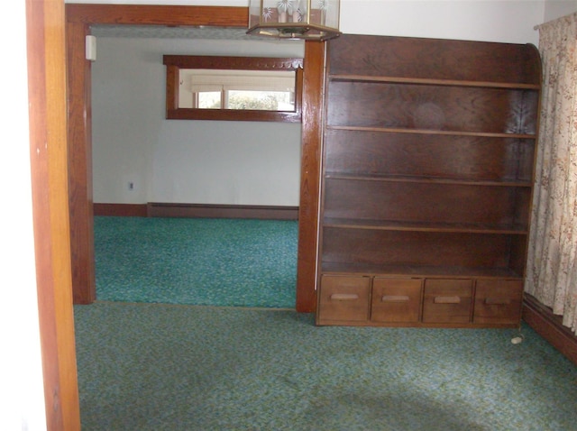 spare room with a baseboard radiator and carpet