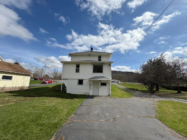 23 Riverside Dr, Roscoe, NY 12776 - back of house featuring a chimney and a yard